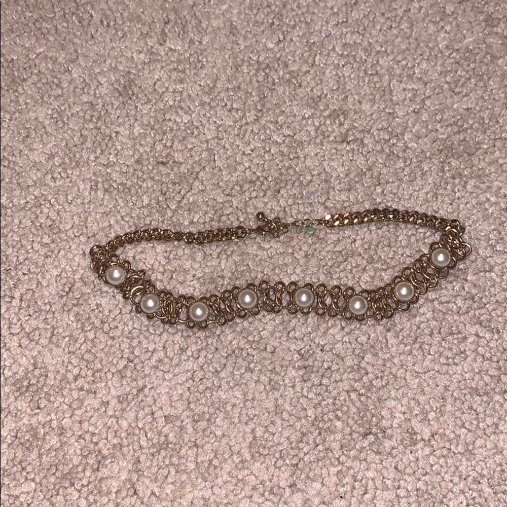 Gold pearl chicken necklace.